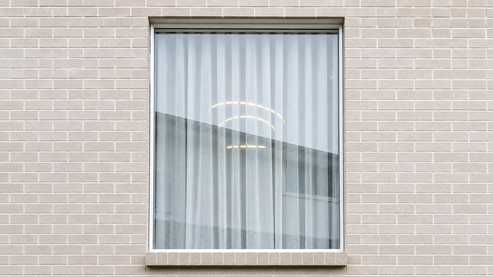 Custom sheer curtains Brisbane exterior window view — Security Screens Qld